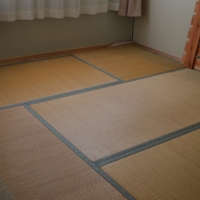 Traditional Tatami Mat Configuration in Temporary Housing Bedroom